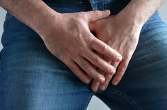 man-with-purple-penis-covering-his-crotch-with-his-hands.jpg